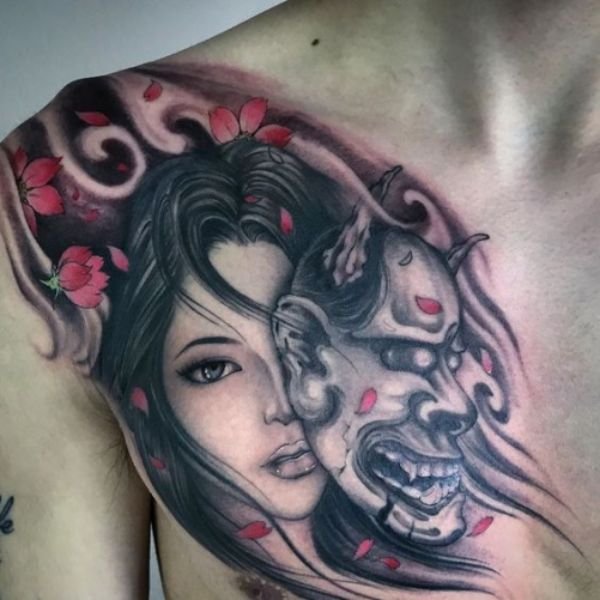 Tatoo gái mặt quỷ ở ngực