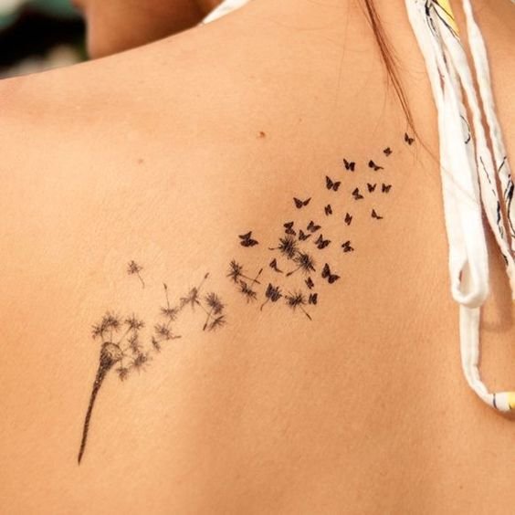 tattoo bồ công anh bay trong gió ở lưng