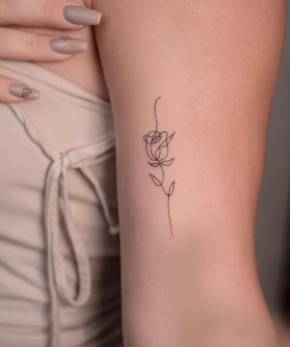 Single line mini rose tattoo