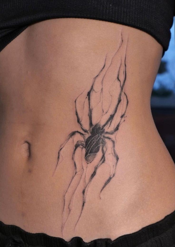 mẫu tattoo con nhện cho nữ ở eo