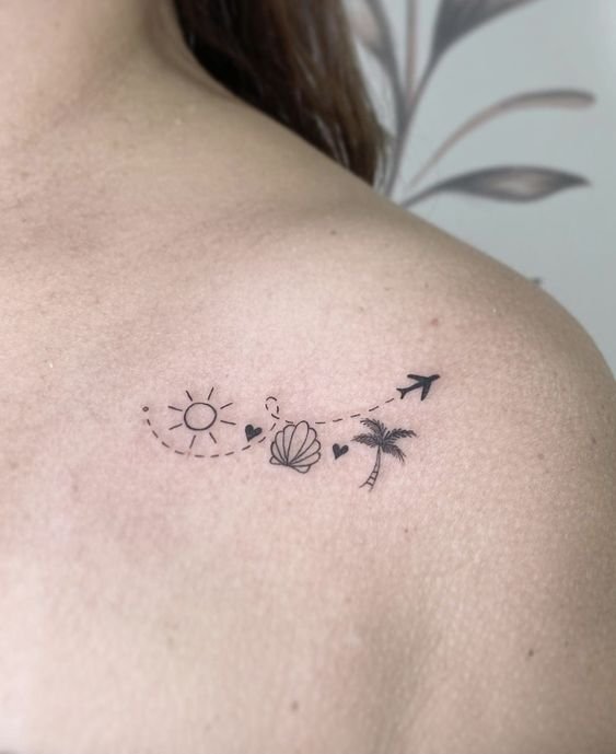 tattoo mini máy bay cùng các họa tiết khác ở vai