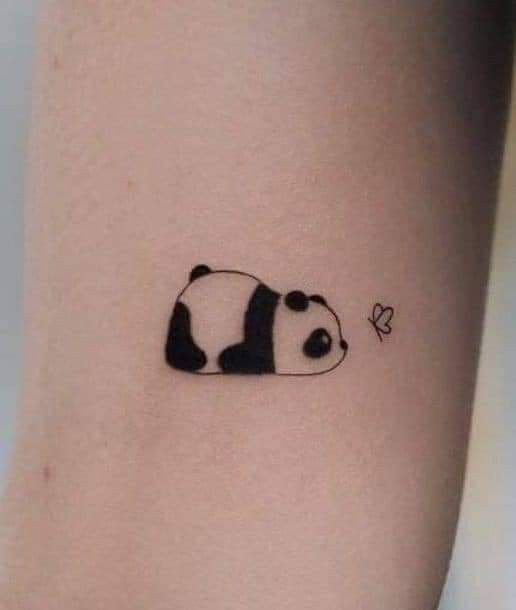 mini lazy panda tattoo on the upper arm